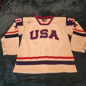 Nike USA White Hockey Jersey with Red and Blue Accents #30 Thomas
